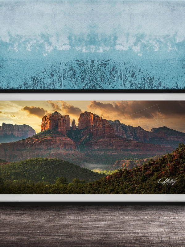 The image is a framed photograph of a scenic landscape with mountains and a sunset sky.