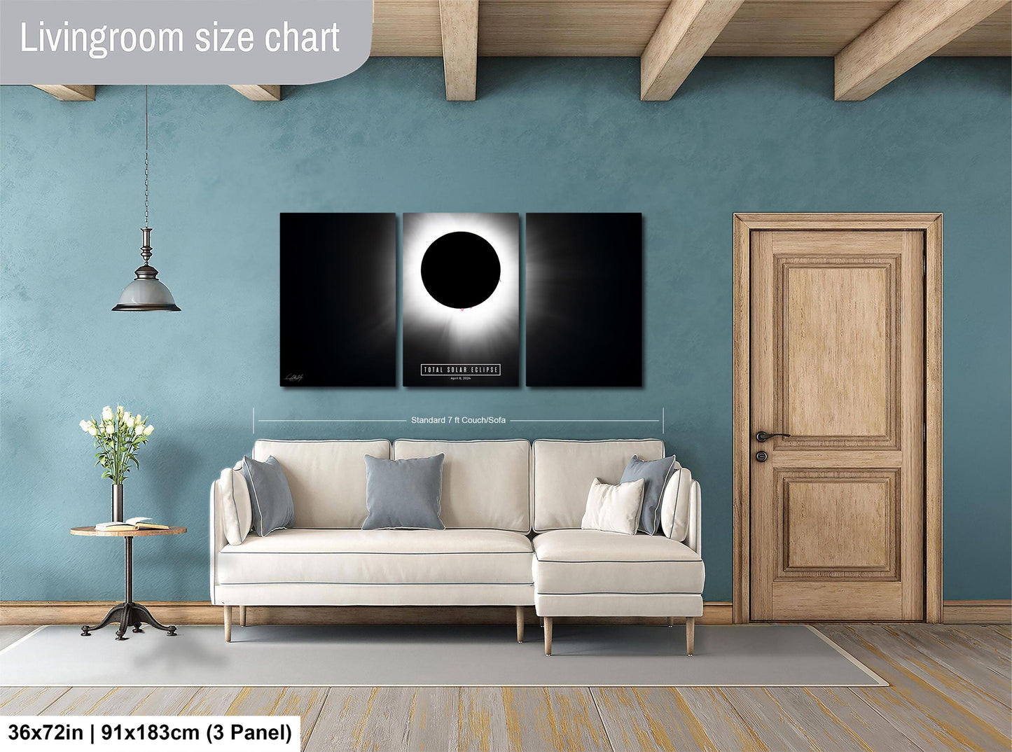 a living room with a couch and two paintings on the wall