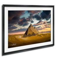 the iconic pyramids of Giza in Egypt, with a dramatic sky in the background featuring clouds and a colorful sunset.