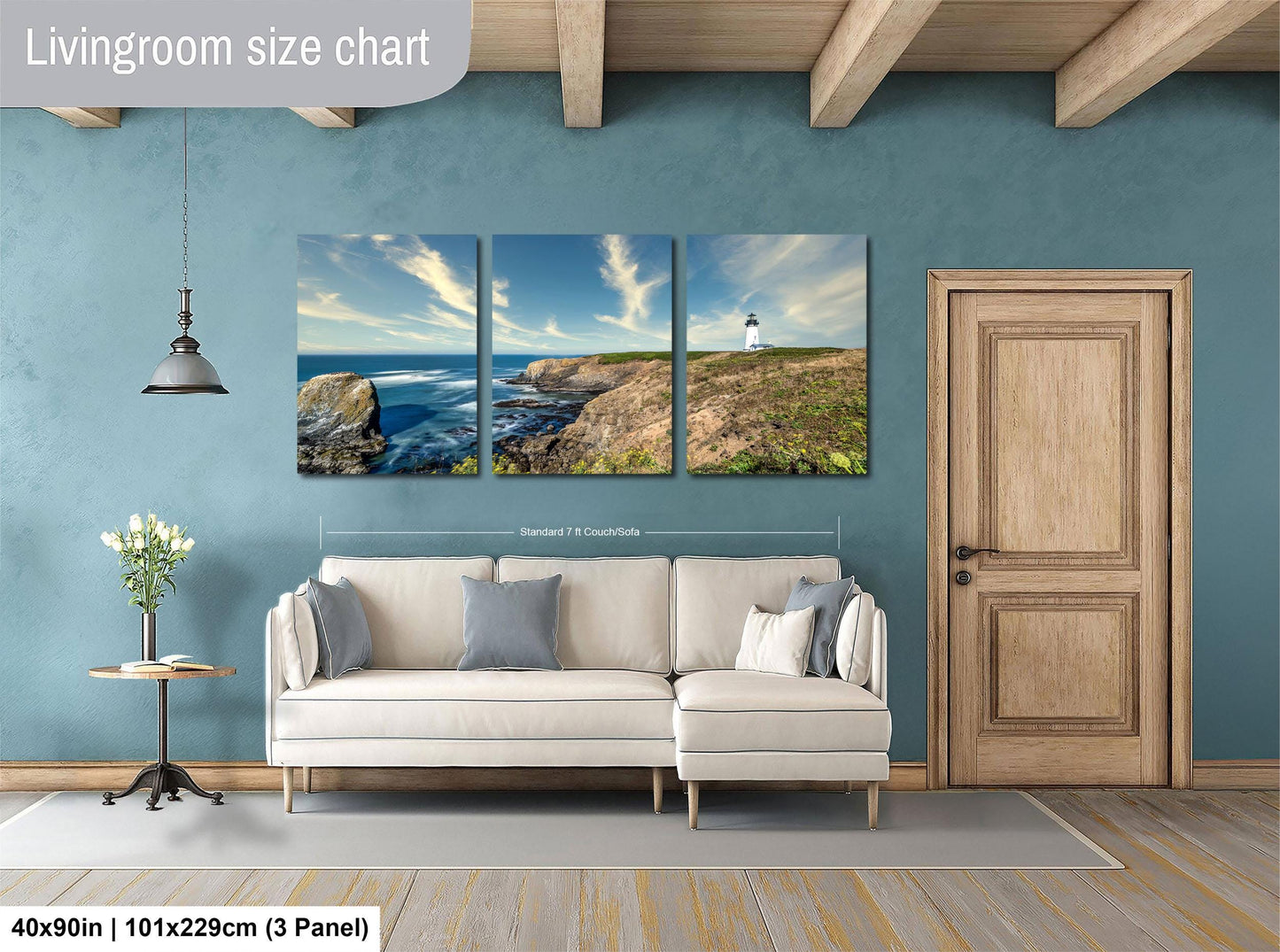 The image is a livingroom with a large wall-mounted painting depicting a scenic coastal landscape with a lighthouse on a cliff. The painting is divided into three panels, each showcasing different aspects of the landscape. The room has a white sofa and a wooden door, creating a cozy and inviting atmosphere.
