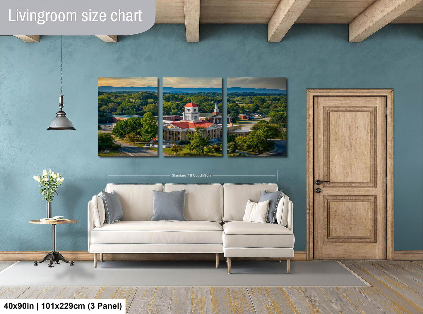The image is a living room with a large, three-panel living room size chart on the wall. The chart displays the dimensions of the living room in feet and inches, with the largest panel measuring 40'x50'', the medium panel measuring 101'x129'', and the smallest panel measuring 3'x3''.
