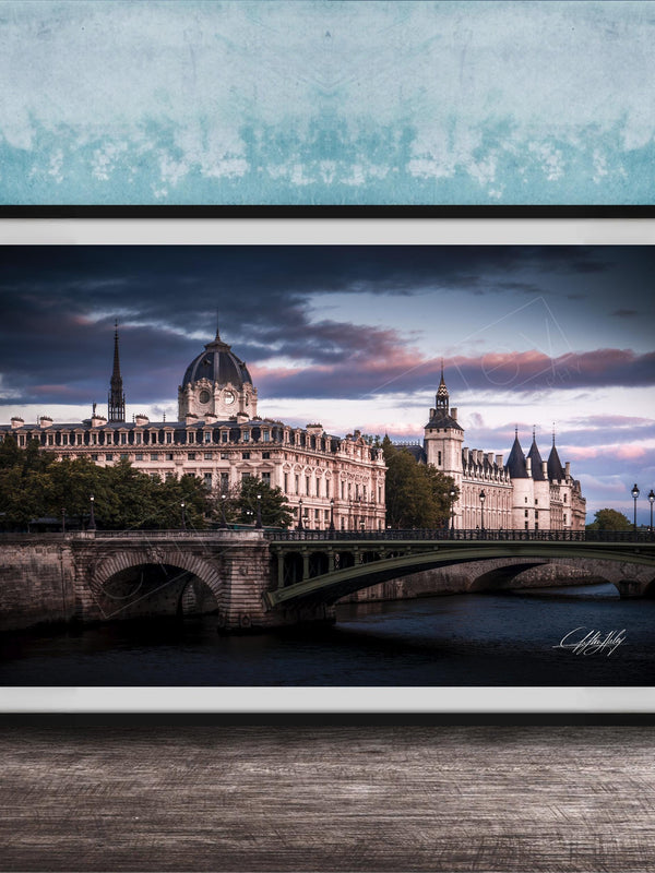 a picturesque scene of a historic building with a dome and a bridge spanning a river, set against a dramatic sky with clouds.