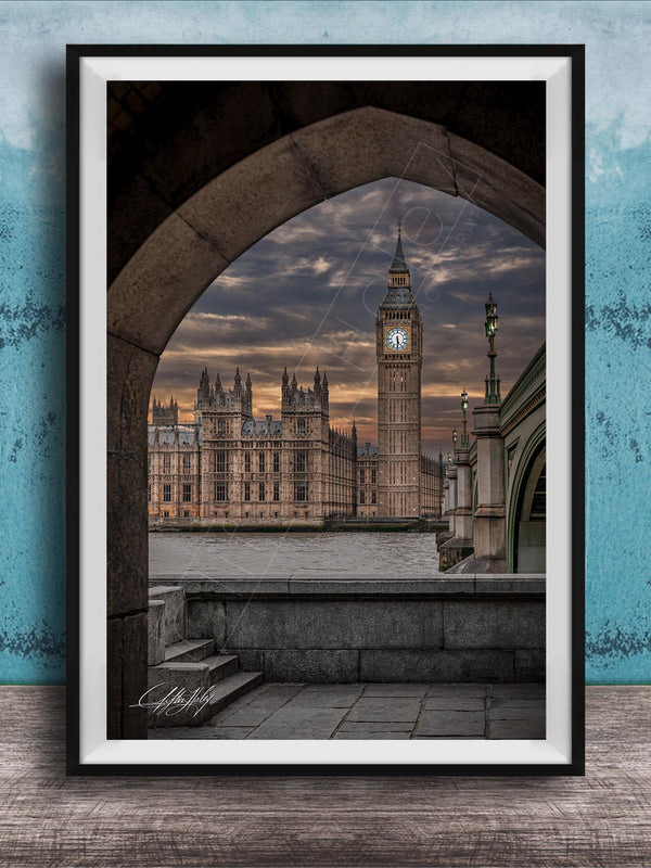 a framed view of the Palace of Westminster and Big Ben in London, England, with the iconic clock tower visible against a dramatic sky.