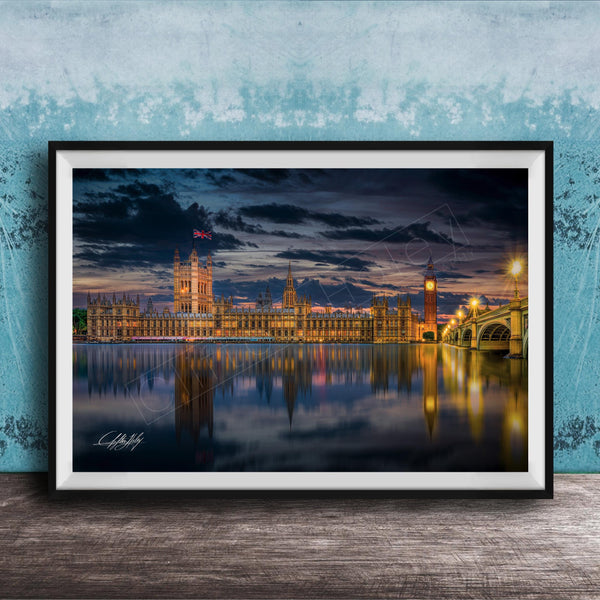 a city skyline at night, with the buildings illuminated and reflected in the water below.