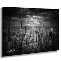 A black and white photograph of the New York City skyline, featuring the iconic Empire State Building and other skyscrapers.
