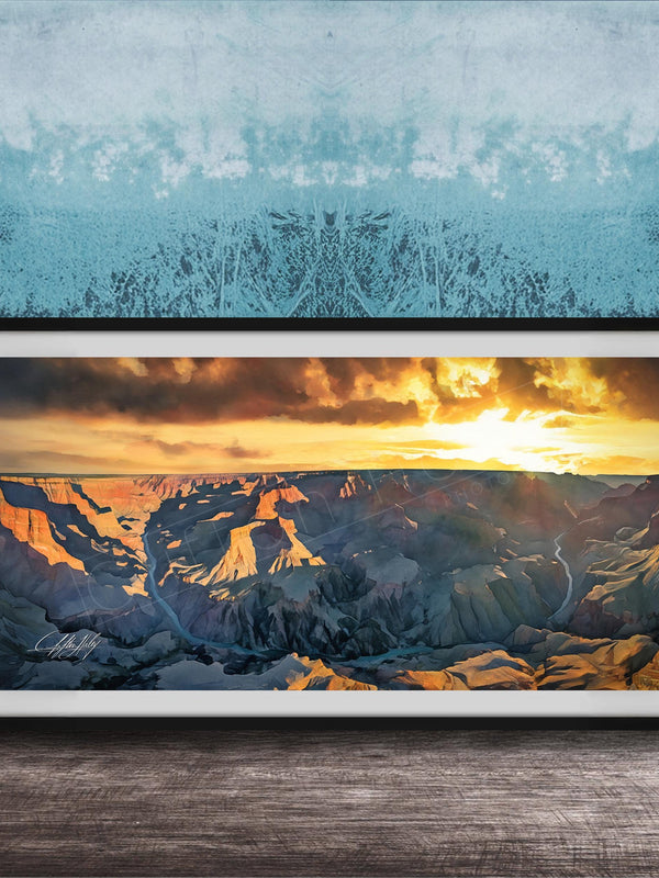 The image is a framed photograph of a breathtaking view of the Grand Canyon at sunset, with the sun setting behind the mountains and casting a warm, golden glow over the landscape.