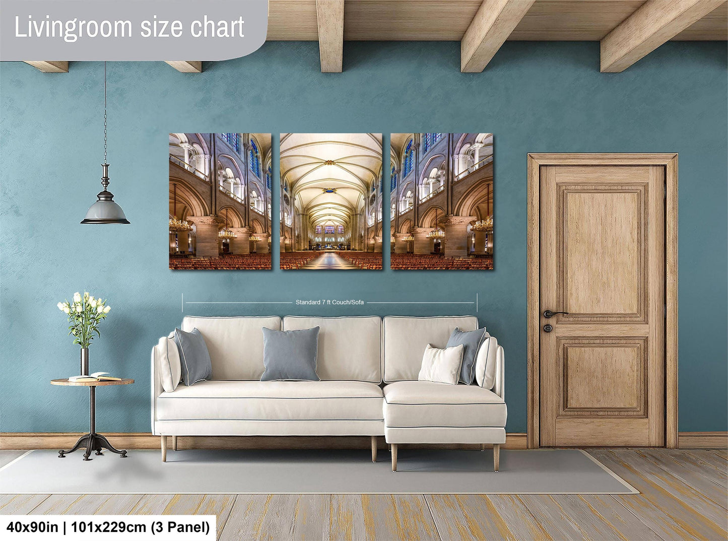 The image is a living room with a large, high-quality photograph of a cathedral or church interior displayed on the wall. The photograph is composed of three panels, and the living room has a white sofa and a wooden door.