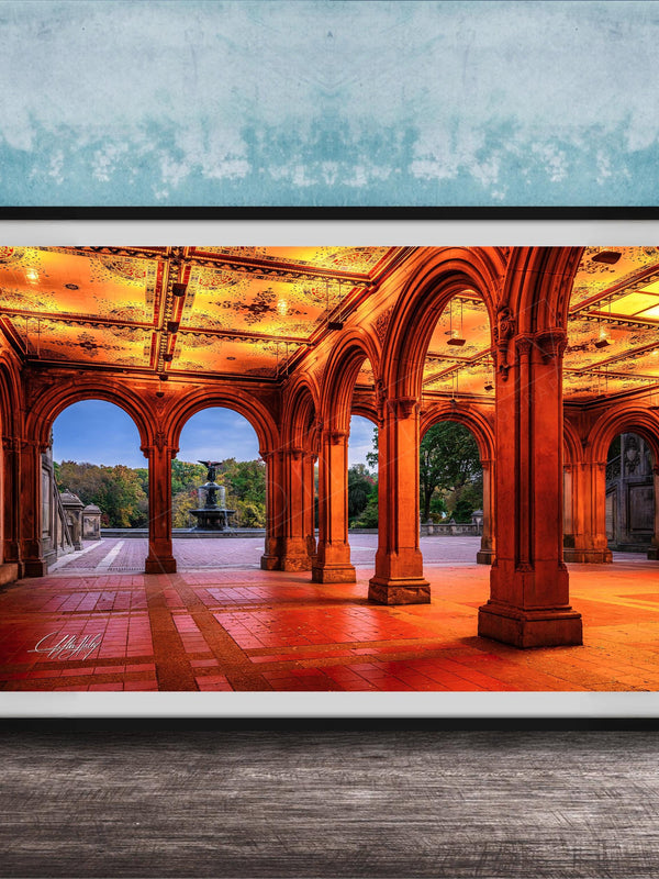A framed photograph of a grand, ornate building with arched doorways and columns, illuminated by warm lighting, creating a visually striking and inviting scene.