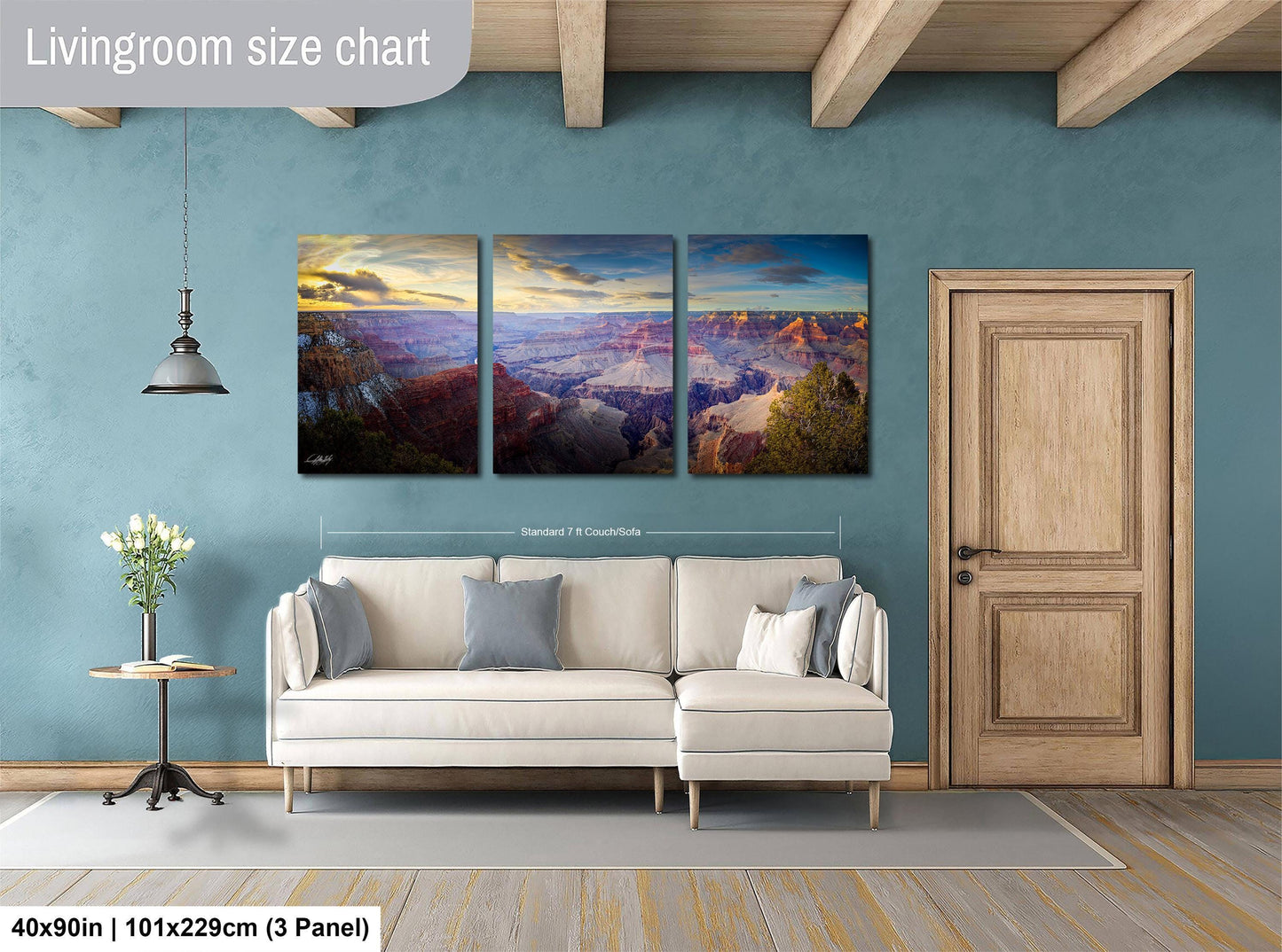 a living room with a couch and two paintings on the wall