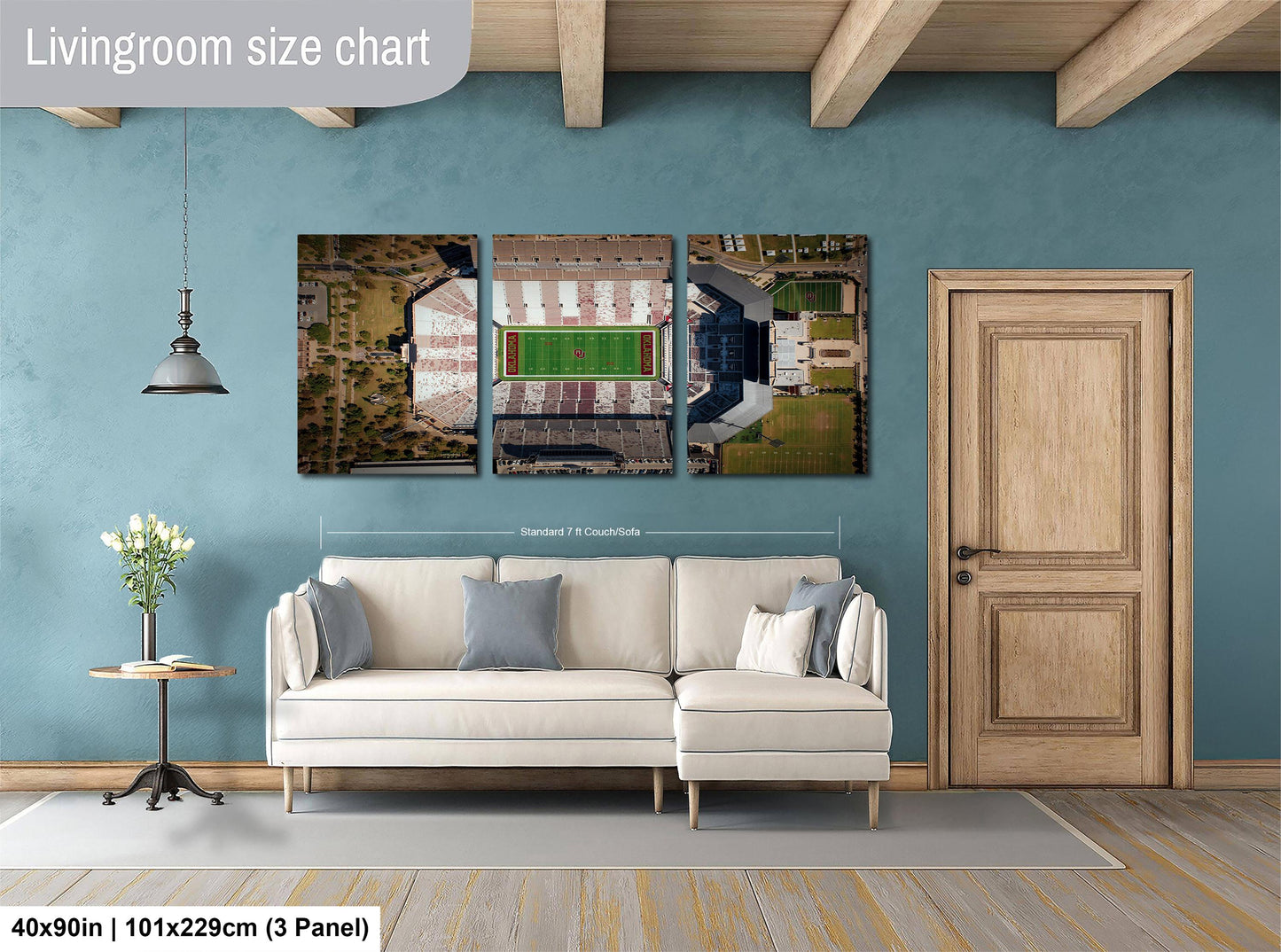The image is a living room with a white sofa, a wooden door, and a wall with a large living room size chart.