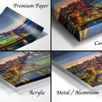 The image is a collage of four different views of a city skyline at sunset, with the cityscape appearing in various materials such as acrylic, metal, and canvas wrap.