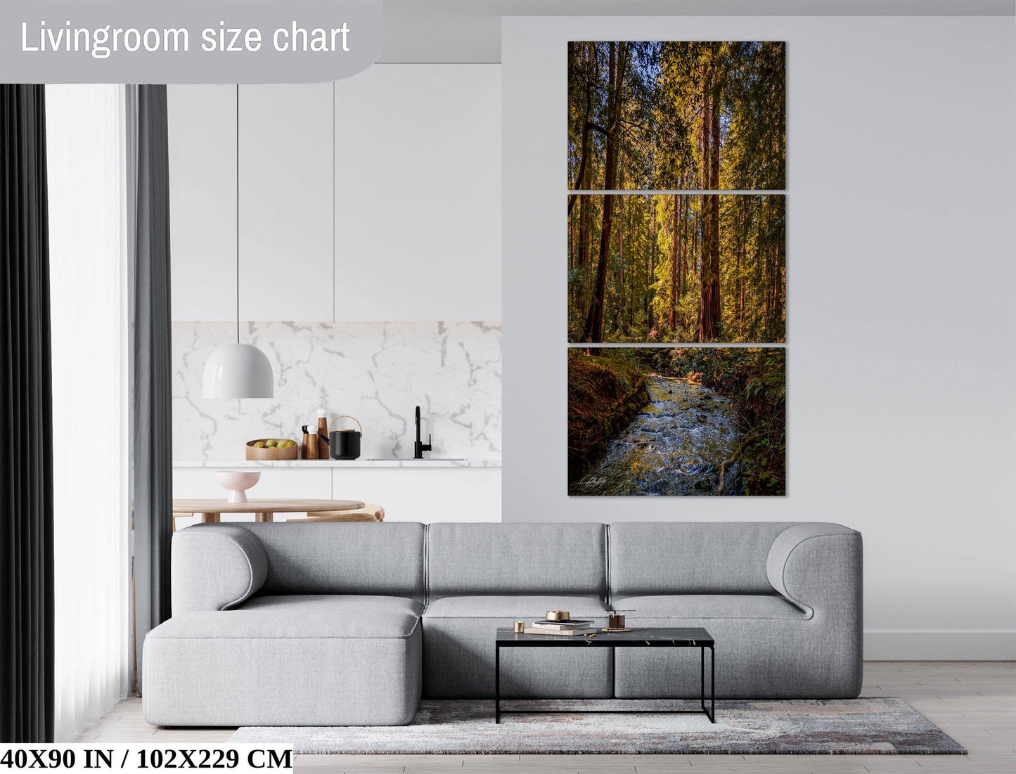 The image is a living room with a gray sofa, a coffee table, and a large painting of a forest scene hanging on the wall.
