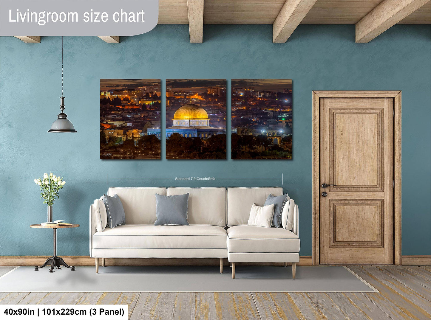 The image is a living room with a large white sofa, a wooden door, and a wall with a large living room size chart. The chart provides dimensions for the living room, including the width and height.