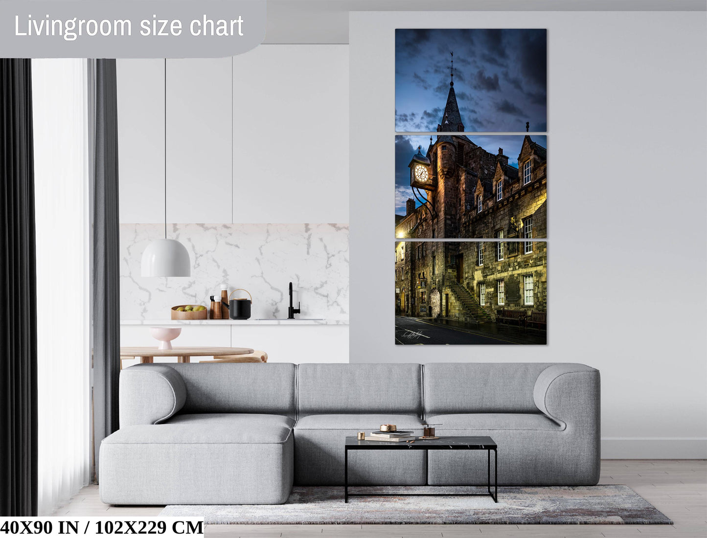 The image is a living room with a gray sofa, a coffee table, and a large wall art depicting a castle at night.