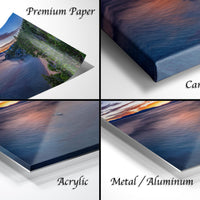 The image is a collage of four different views of a sunset over a body of water, each captured in a different medium: premium paper, canvas wrap, acrylic, and metal/aluminum.