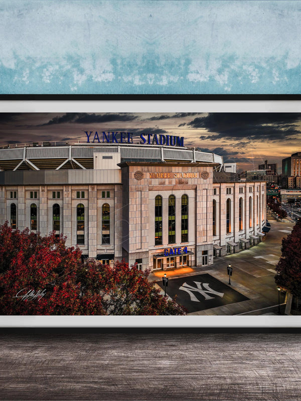 A framed photograph of Yankee Stadium, a baseball stadium in New York City, with the iconic Yankee Stadium sign prominently displayed.
