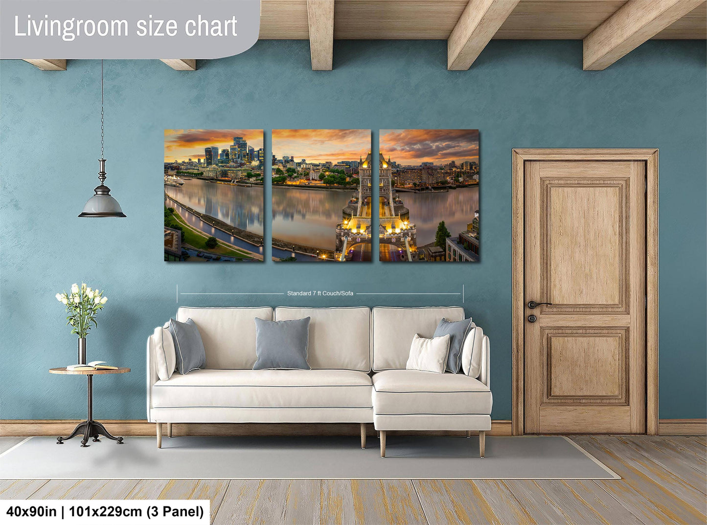 The image is a living room with a large, three-panel living room size chart on the wall. The chart displays the dimensions of the living room in feet and inches, with the largest panel being 40'x50'', followed by a smaller panel of 101'x129'', and the smallest panel of 103'x129''. The living room also includes a white sofa, a wooden door, and a vase of flowers on a table.