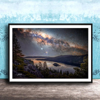 The image is a framed photograph depicting a serene night scene with a lake, mountains, and a starry sky.