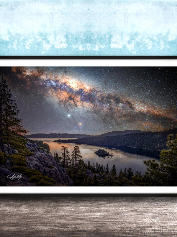 The image is a framed photograph depicting a serene night scene with a lake, mountains, and a starry sky.