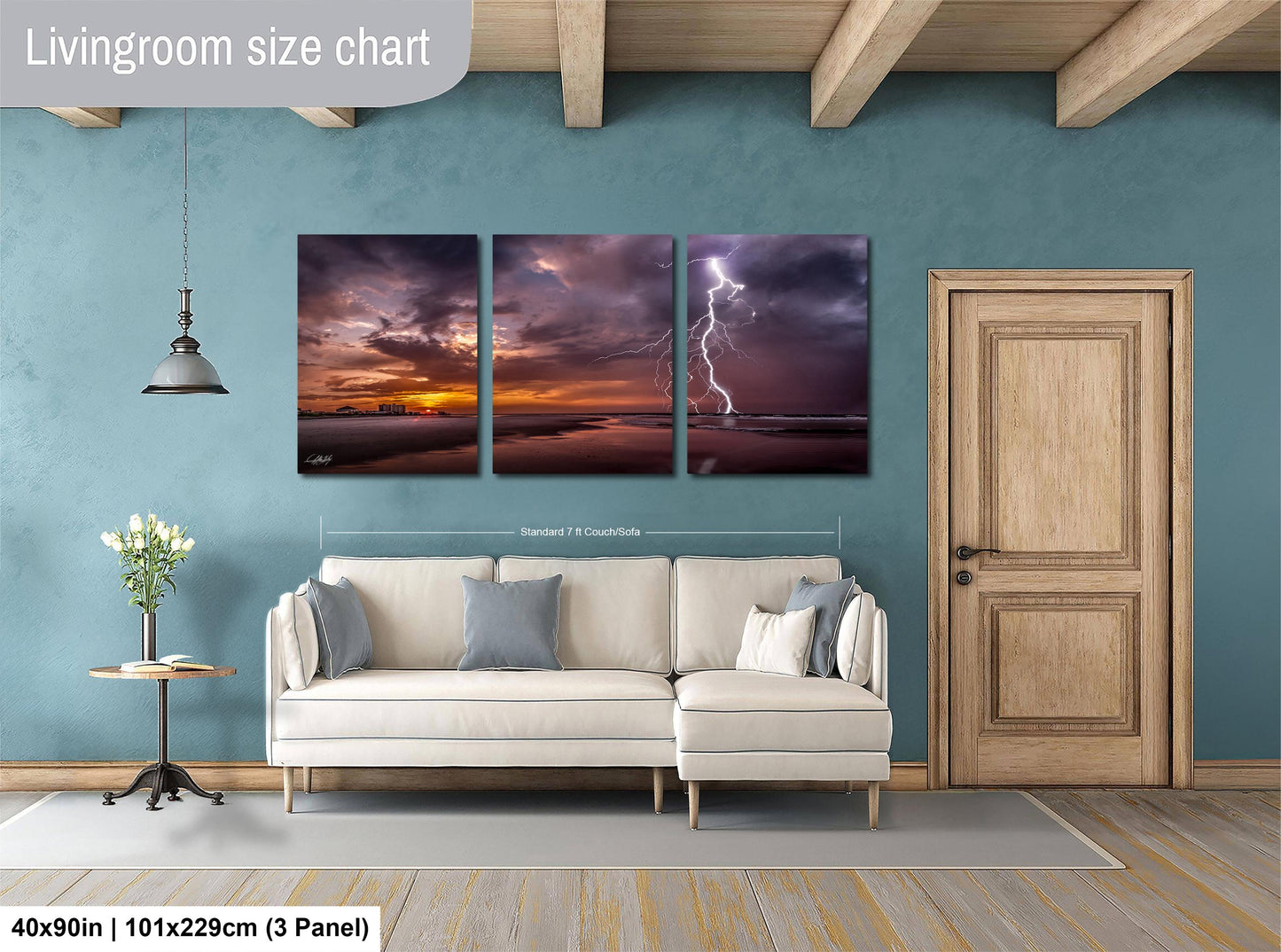 The image is a living room with a white sofa and a wooden door. Above the sofa, there is a triptych of landscape paintings depicting a dramatic sky with lightning. The paintings are framed and hung on the wall, creating a striking visual focal point in the room.