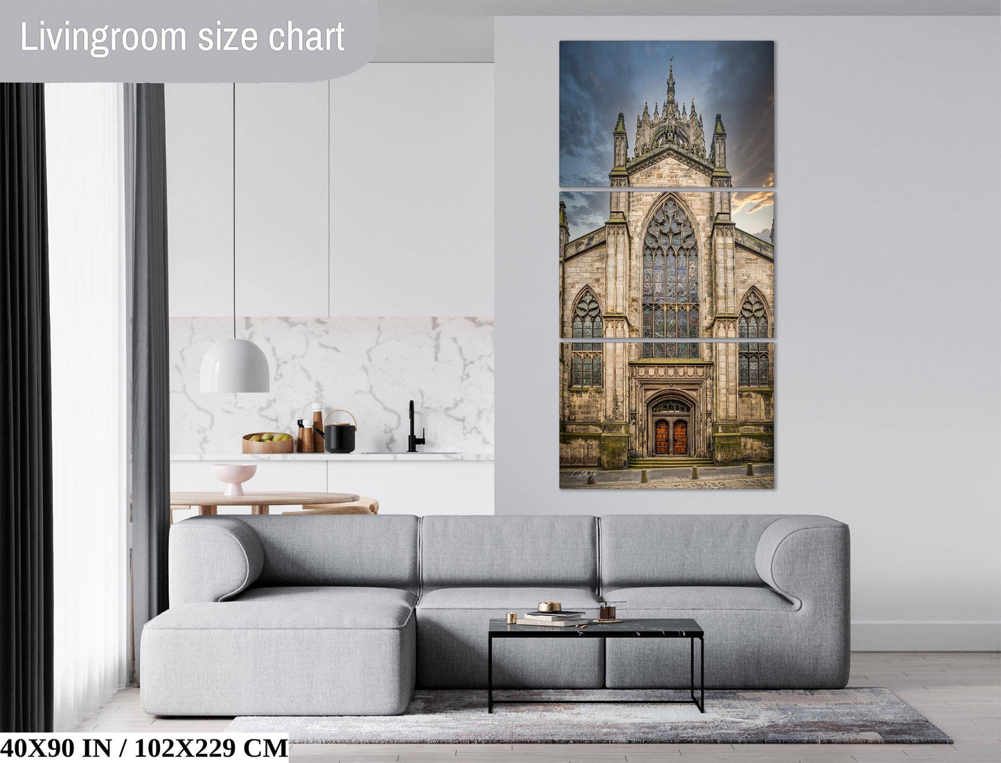 The image is a living room with a gray sofa, a coffee table, and a large painting of a Gothic cathedral on the wall.