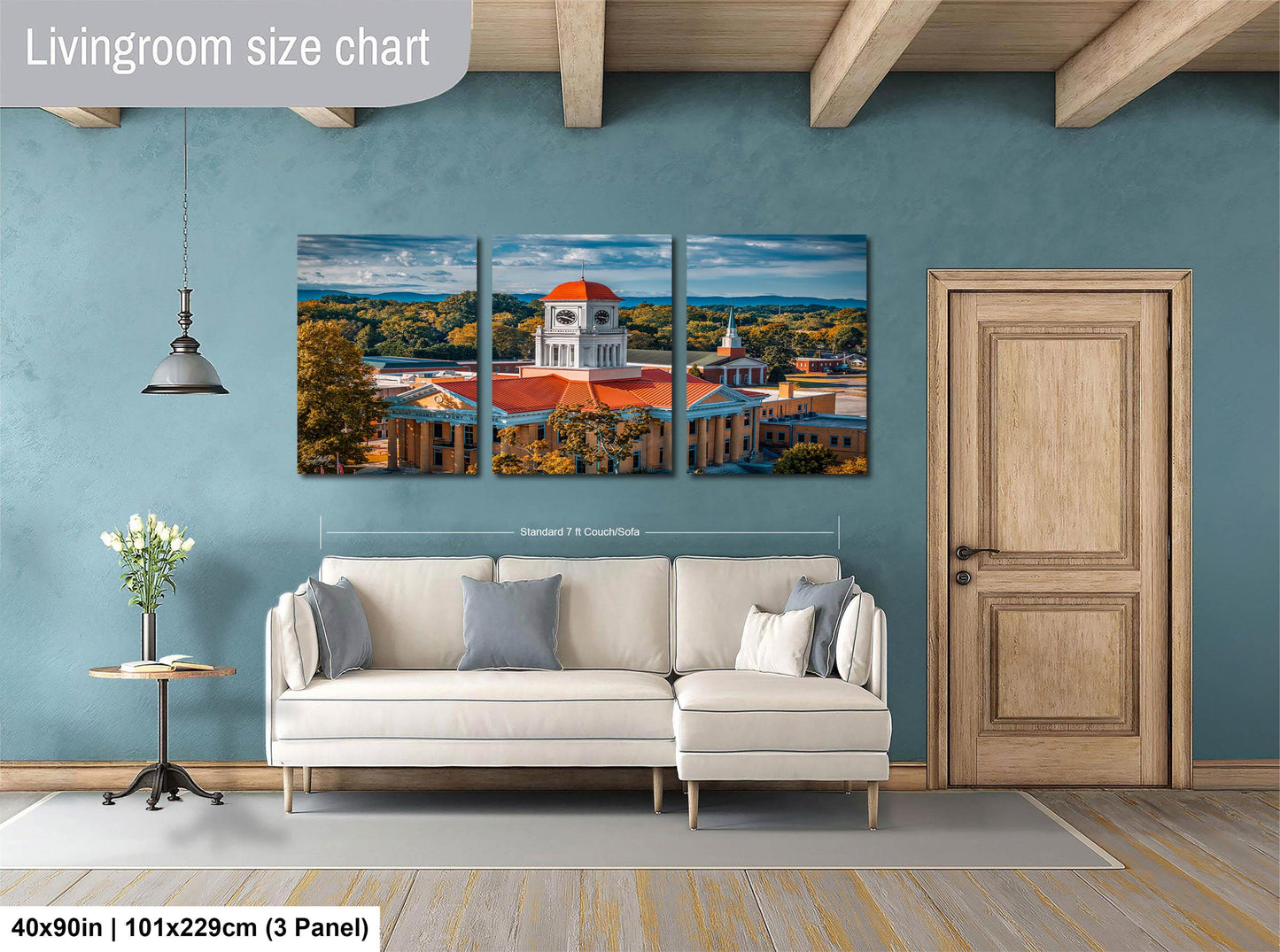 The image is a living room with a large, three-panel living room size chart on the wall. The chart displays the dimensions of the living room in feet and inches, with the largest panel being 40'x50'', the medium panel being 101'x129'', and the smallest panel being 103'x229''. The living room also includes a white sofa, a wooden door, and a small table with a vase of flowers.