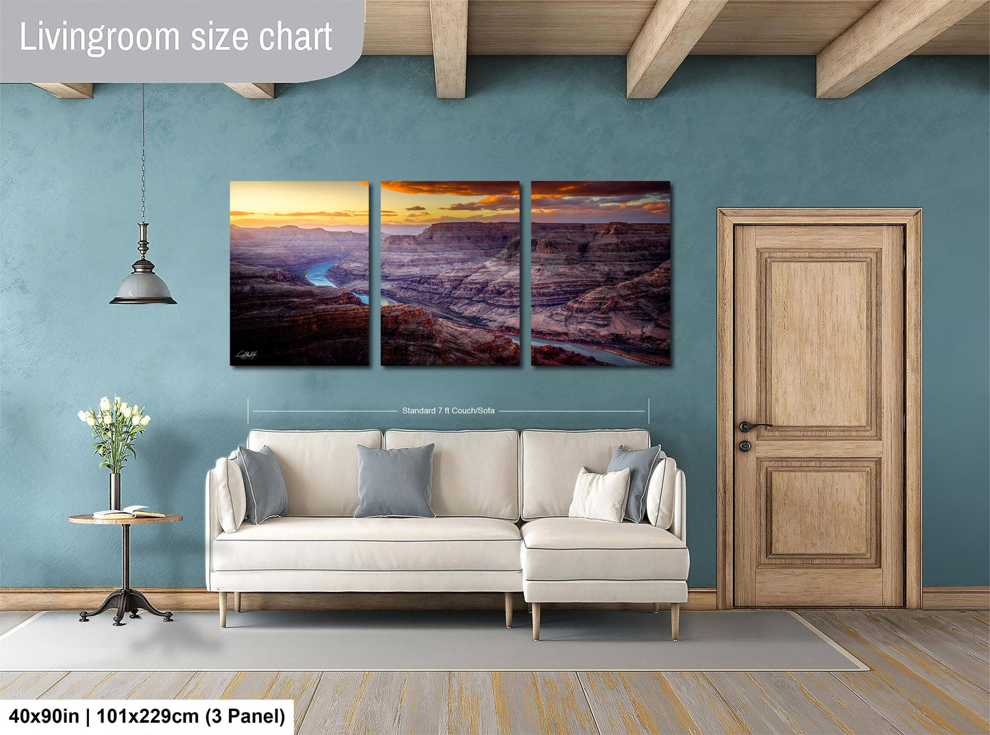 a living room with a couch and two paintings on the wall