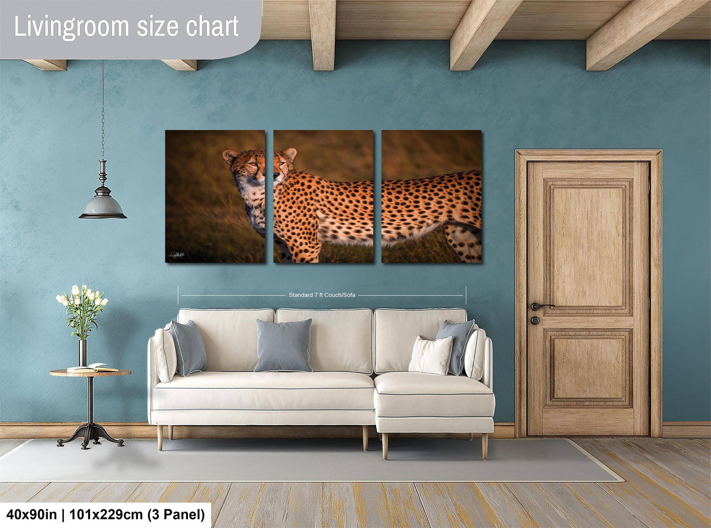 The image is a living room with a large white sofa, a wooden door, and a painting of a cheetah on the wall.
