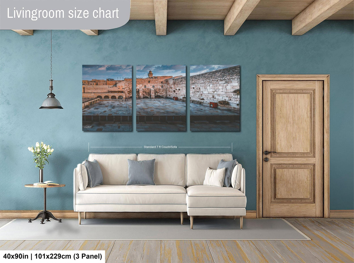 The image is a living room with a large, three-panel living room size chart on the wall. The chart provides dimensions for the living room, including the width and height. The living room is furnished with a white sofa and a wooden door, and there is a vase of flowers on a table nearby.