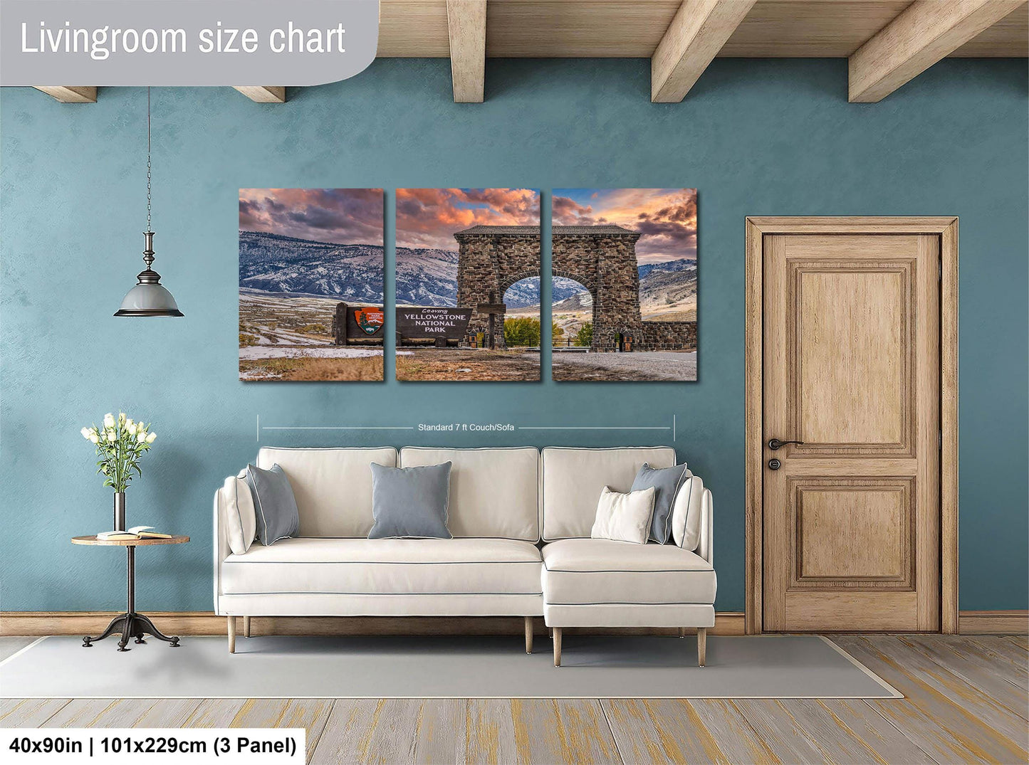 The image is a living room with a large, three-panel living room size chart on the wall. The chart displays the dimensions of the living room in feet and inches, with the largest panel measuring 40'x50'', the medium panel measuring 101'x129'', and the smallest panel measuring 103'x229''. The living room also includes a white sofa, a wooden door, and a vase of flowers on a table.