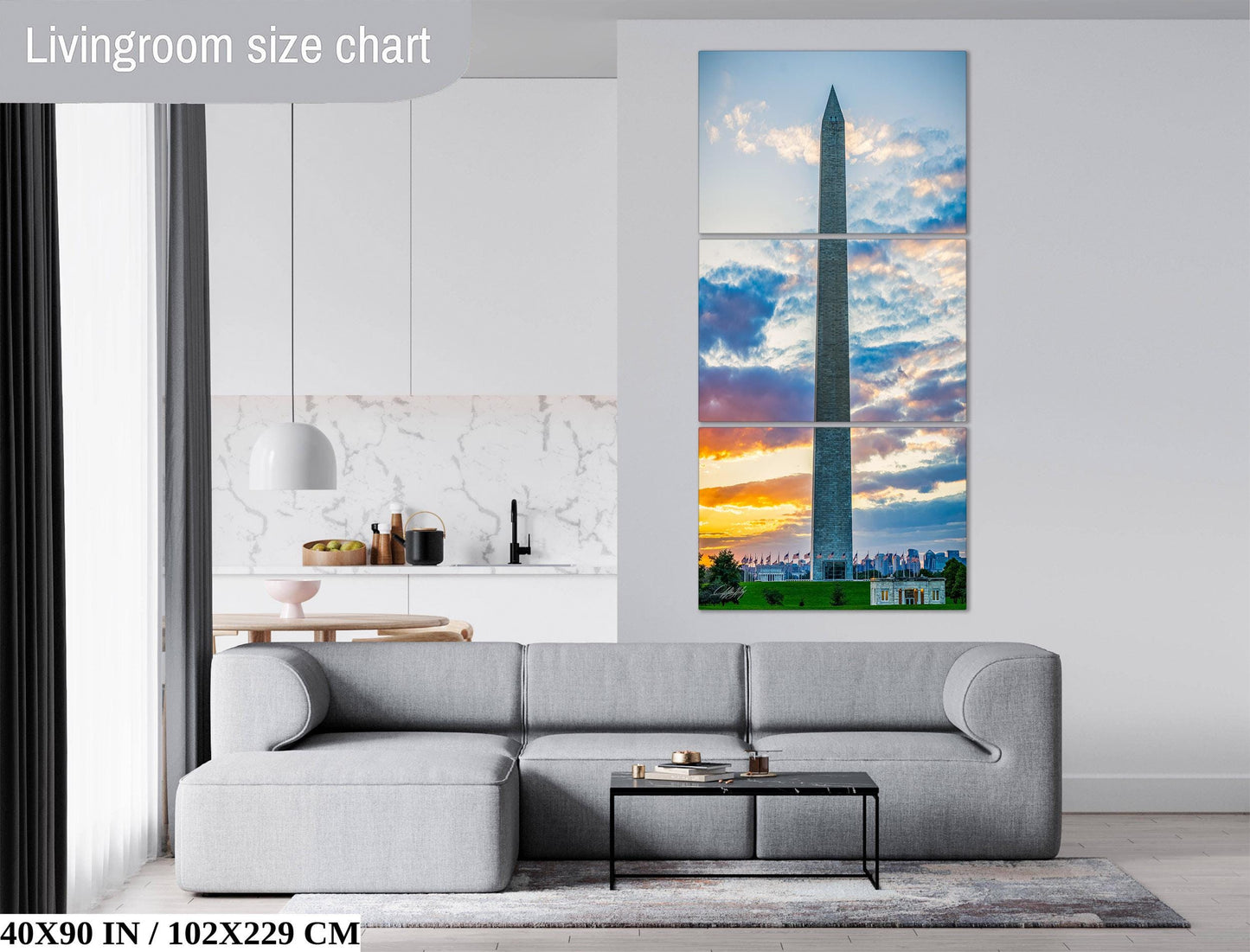 The image is a living room with a gray sofa, a coffee table, and a large wall art depicting the Washington Monument at sunset.