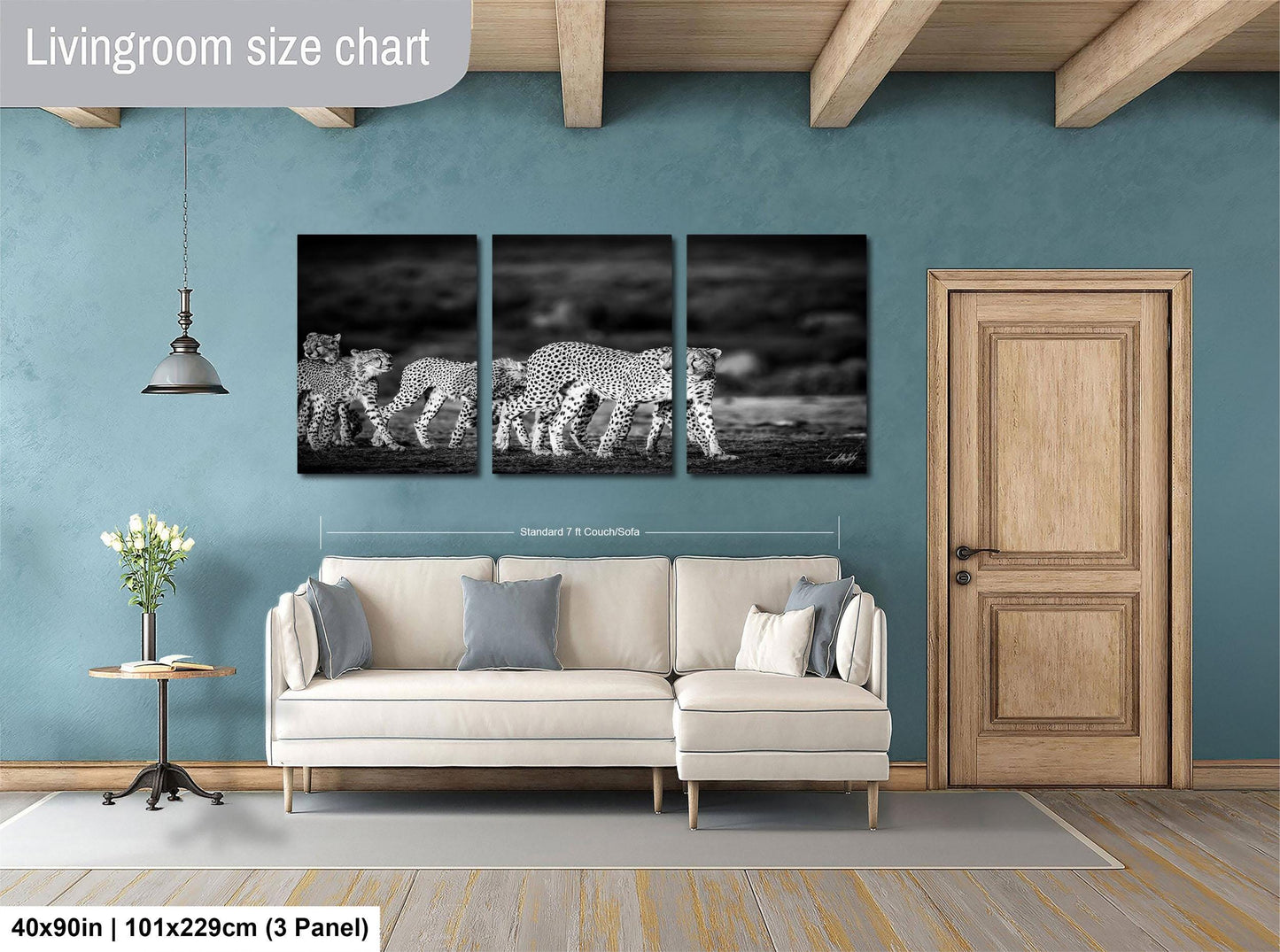 The image is a living room with a large wall art piece depicting a group of leopards walking across a field. The wall art is framed and hangs above a white sofa, which is positioned in front of a wooden door. The room has a wooden floor and a small table with a vase of flowers. The living room size chart indicates that the space is approximately 40'x50' in width and 101'x129' cm in height.