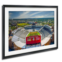 The image is an aerial view of a football stadium with a large red sign that reads "DADY CAMPIEL STADIUM".