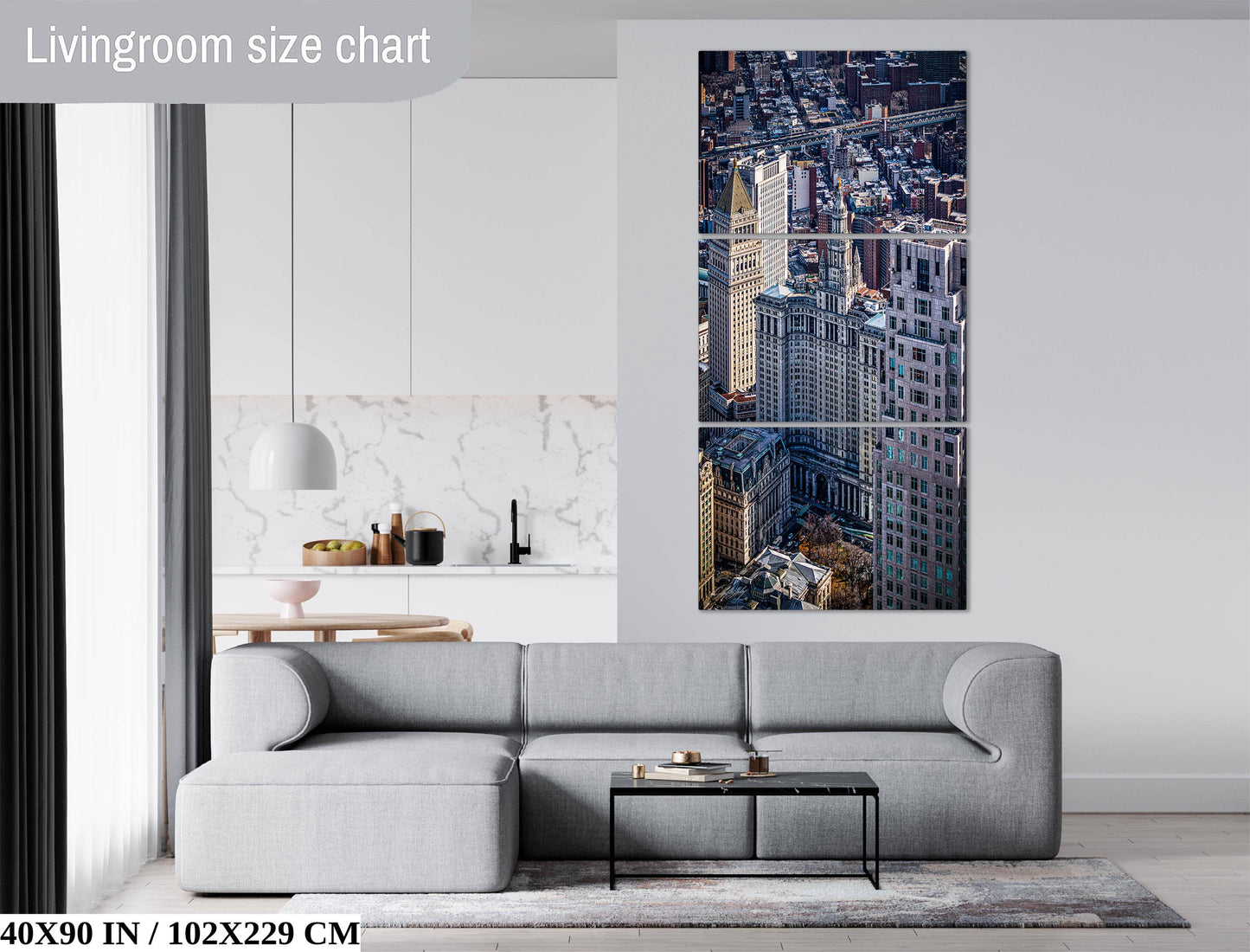 The image is a living room with a gray sofa, a coffee table, and a large wall art depicting a cityscape.