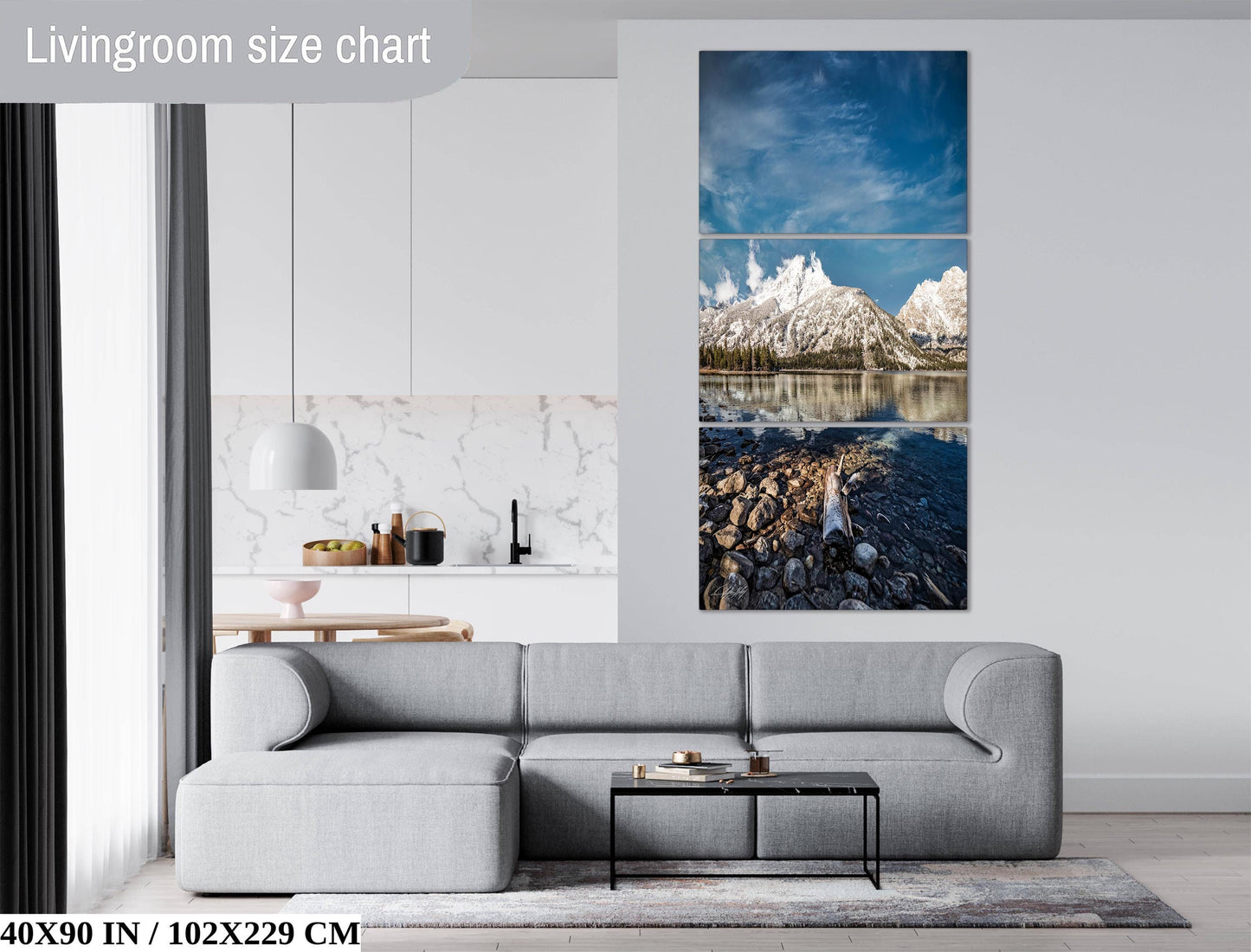 The image is a living room with a gray sofa, a coffee table, and a large wall art depicting a scenic mountain landscape.