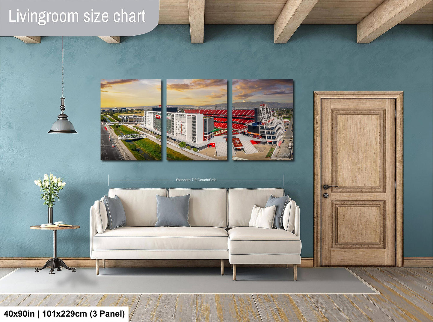 The image is a living room with a large white sofa, a wooden door, and a wall with a large living room size chart. The chart provides dimensions for the living room, including the width and height.