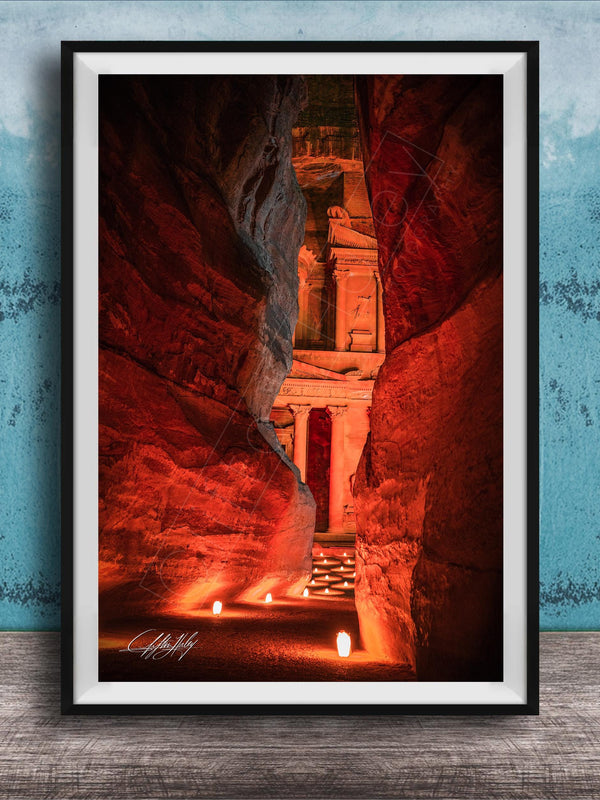 a narrow passage in a cave, with a stone archway leading to a doorway at the end. The passage is illuminated by a warm glow, creating a sense of depth and mystery.