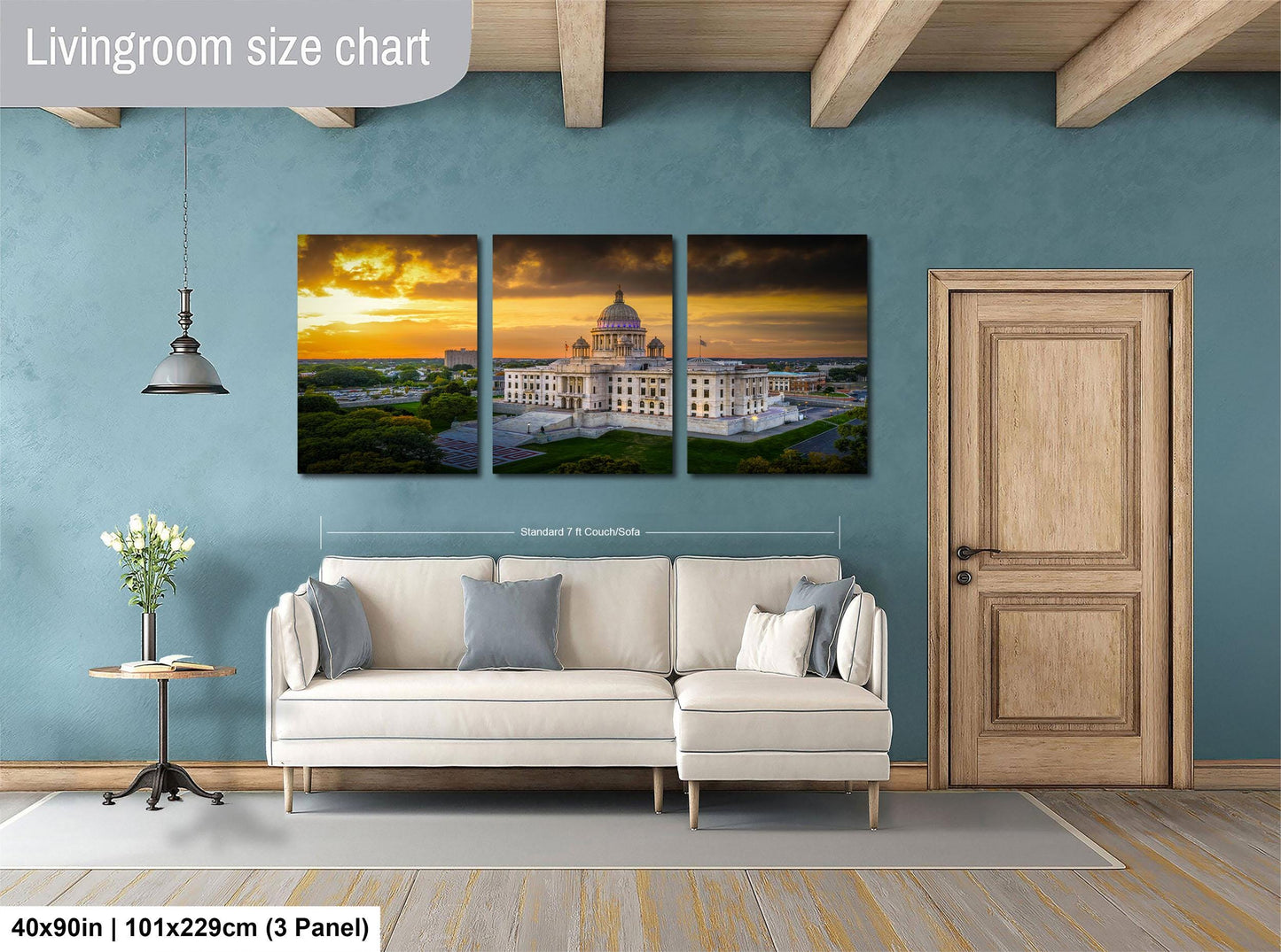 The image is a living room with a large, three-panel living room size chart on the wall. The chart displays the dimensions of the living room in feet and inches, with the largest panel indicating the width of the room. The living room is furnished with a white sofa and a wooden door, and there is a vase of flowers on a table nearby.