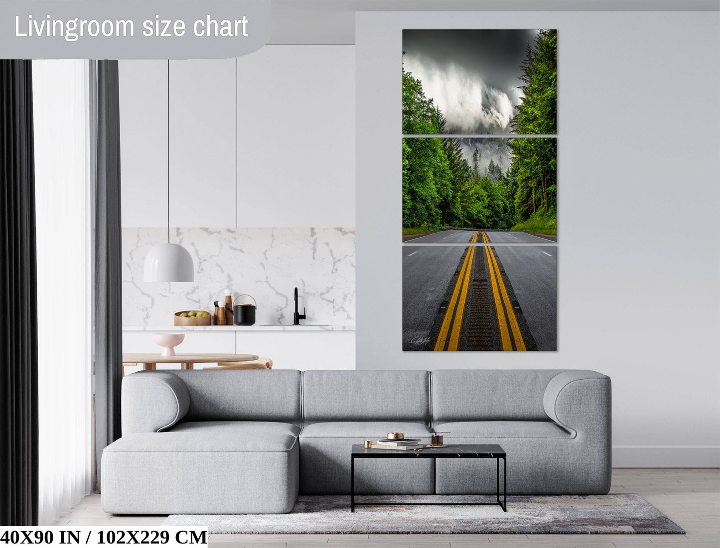 The image is a living room with a gray sofa, a coffee table, and a large wall art depicting a road with yellow lines.