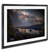 a serene night scene with a lake surrounded by mountains and trees, with a starry sky above.
