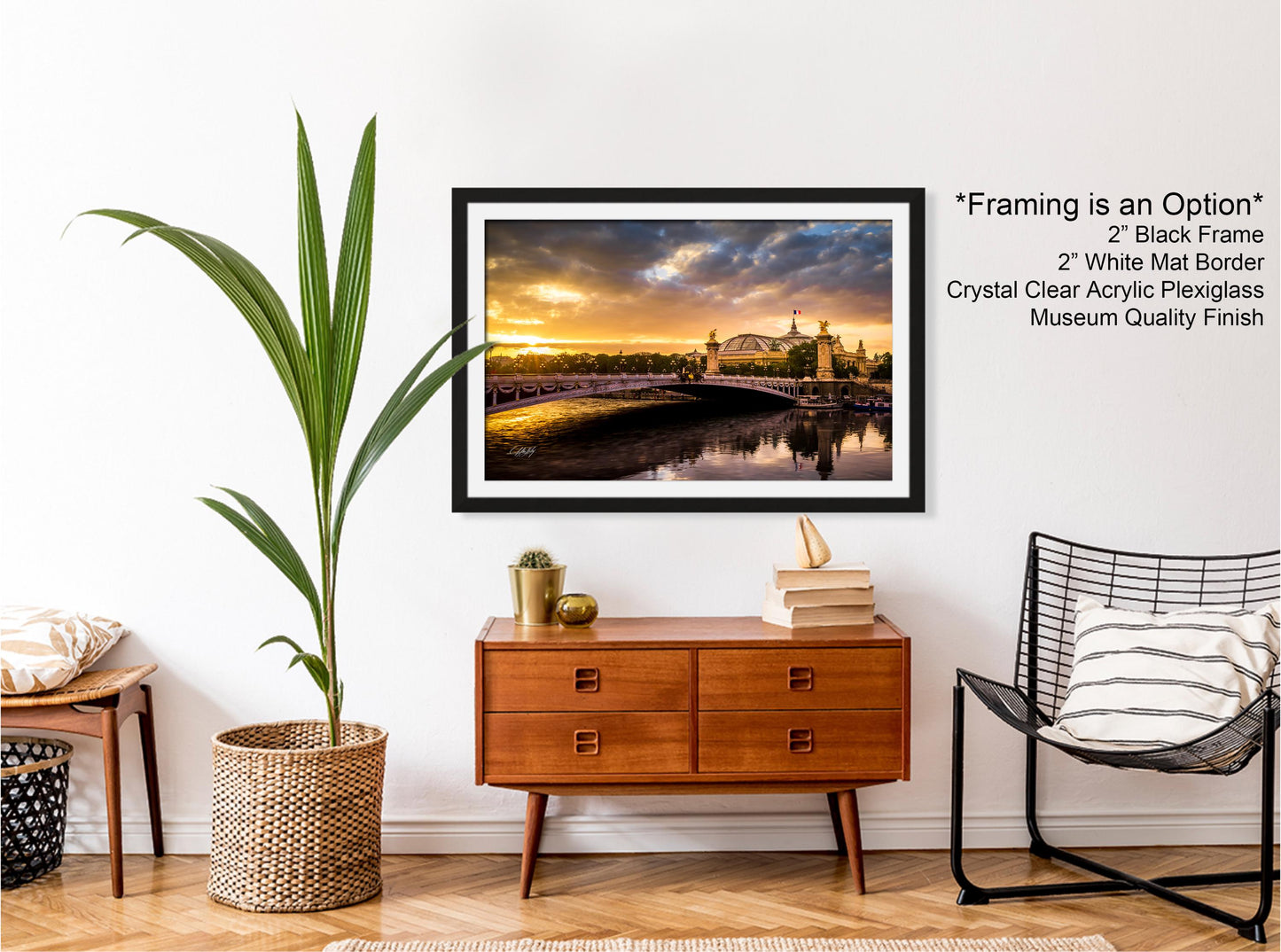 a living room with a picture hanging on the wall