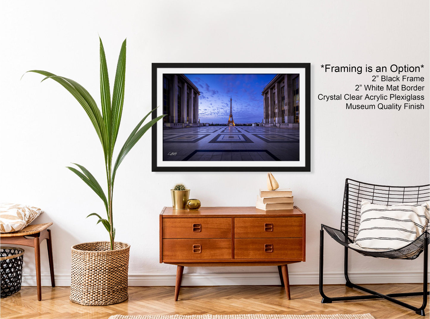 a living room with a chair and a picture on the wall