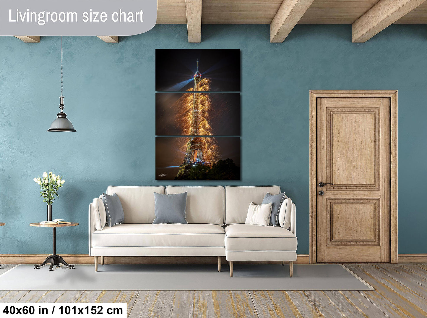 a living room with a couch and a painting on the wall