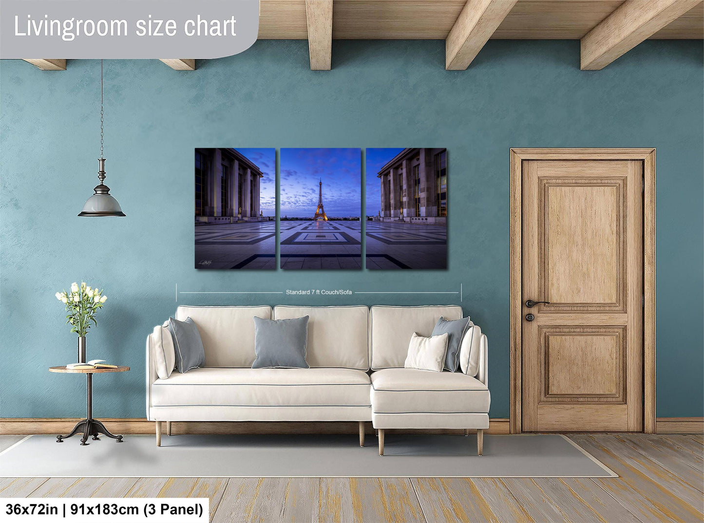 a living room with a couch and a painting on the wall