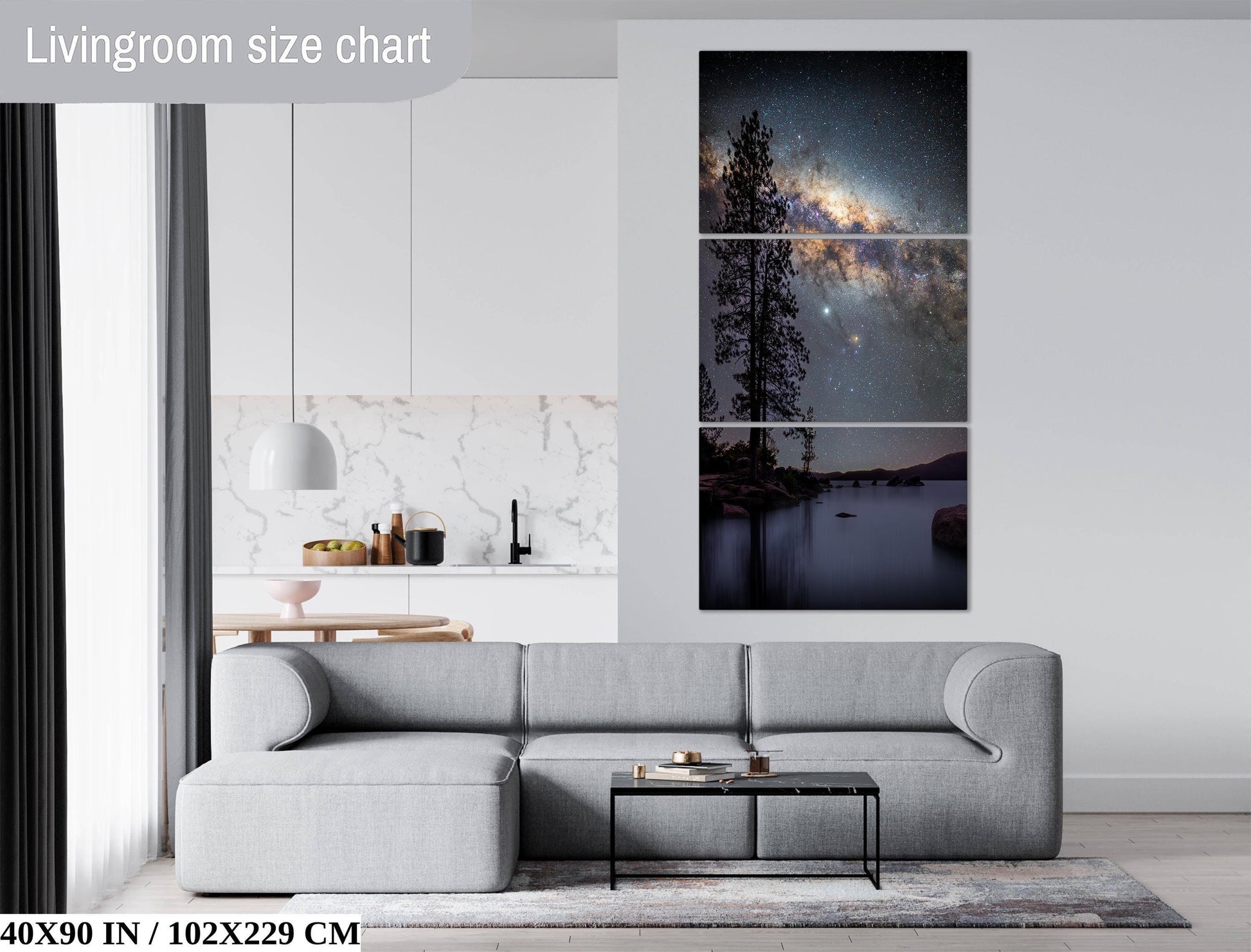 The image is a living room with a gray sofa, a coffee table, and a large wall art depicting a night sky with a galaxy.