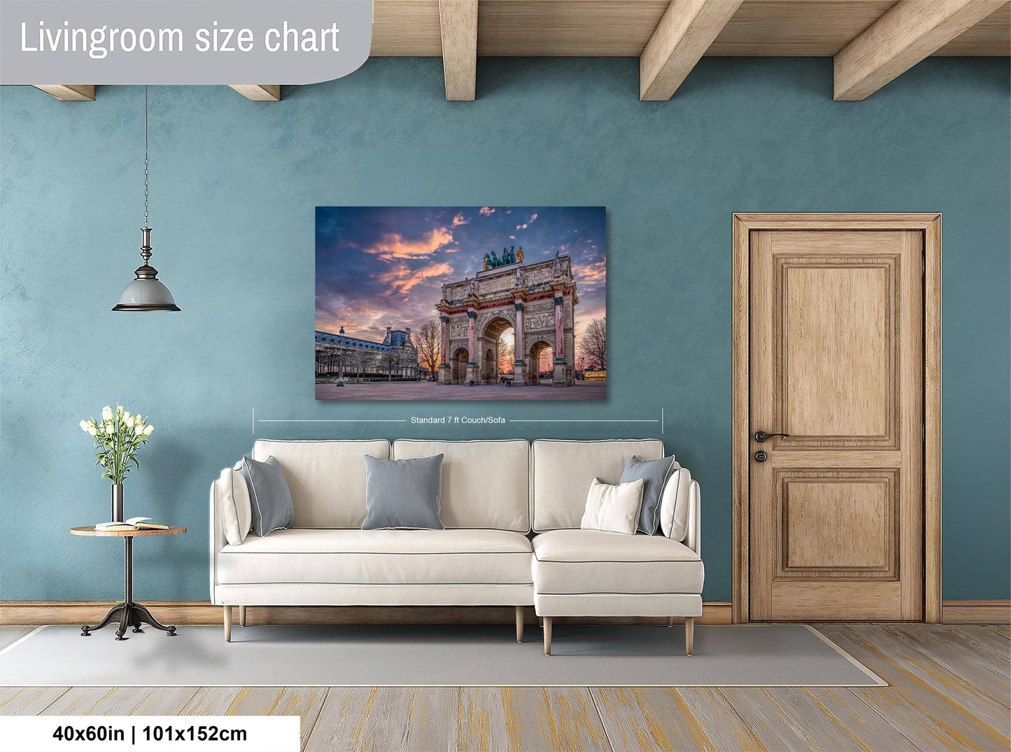 a living room with a large wall-mounted painting depicting the Arc de Triomphe in Paris, France. The painting is framed and hangs above a white sofa. The room has a wooden door and a small table with a vase of flowers. The wall has a blue color, and the floor is made of wood.