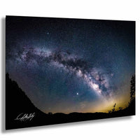a stunning night sky with a vast, colorful galaxy stretching across the frame.