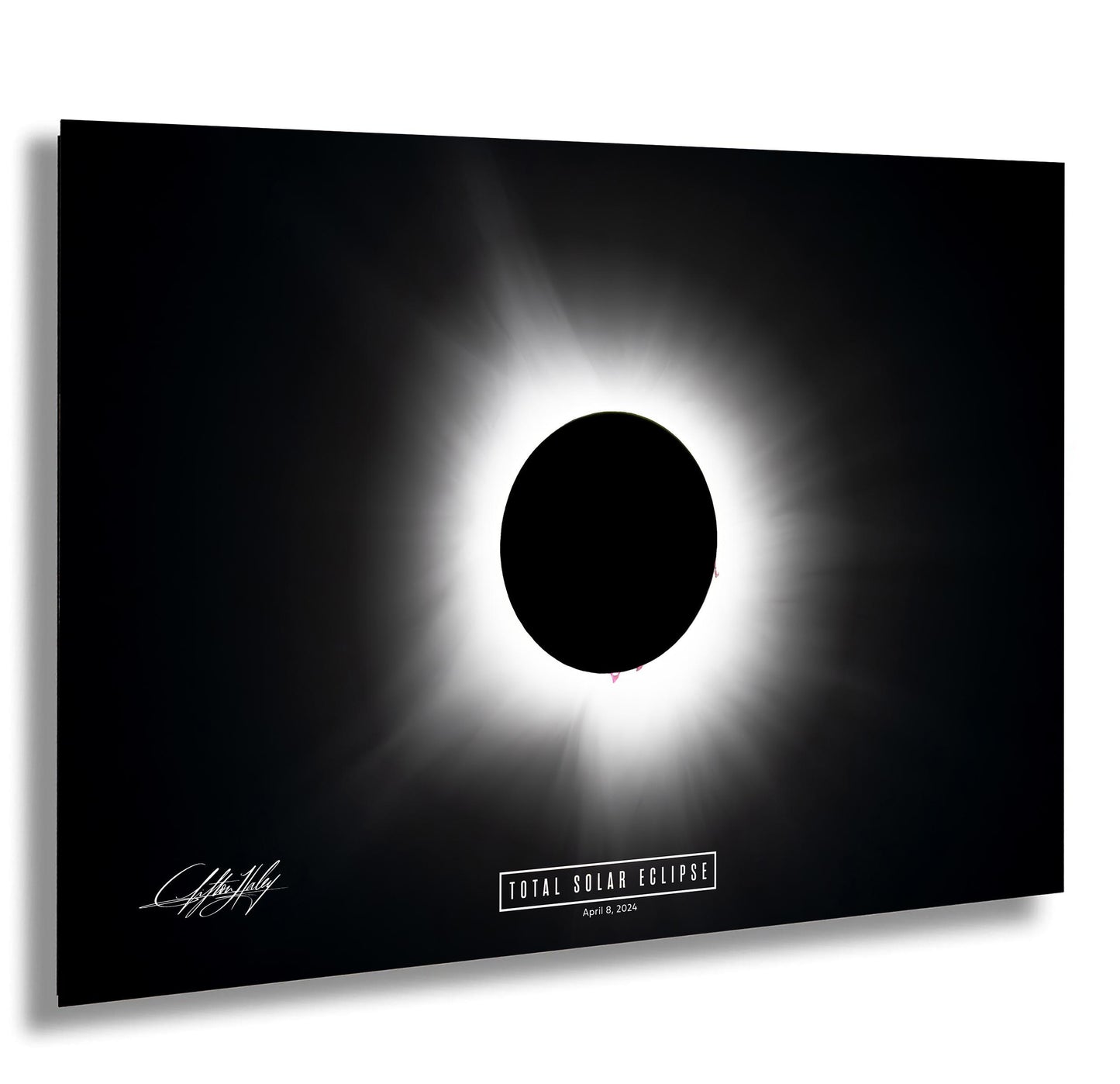 a total solar eclipse, with the sun appearing as a bright white circle against a black background.