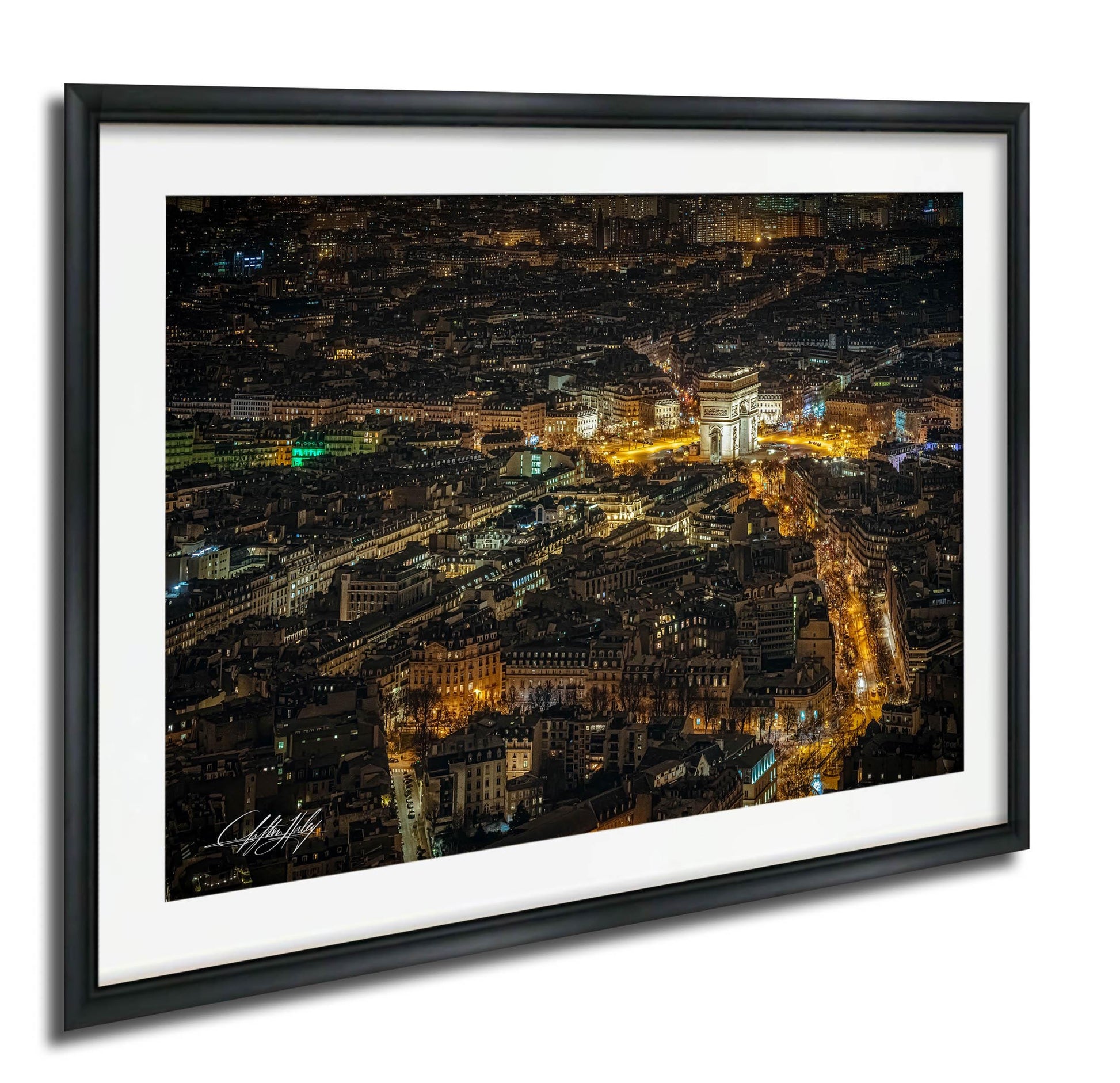 The image is a night view of a city, with numerous illuminated buildings and streets visible.