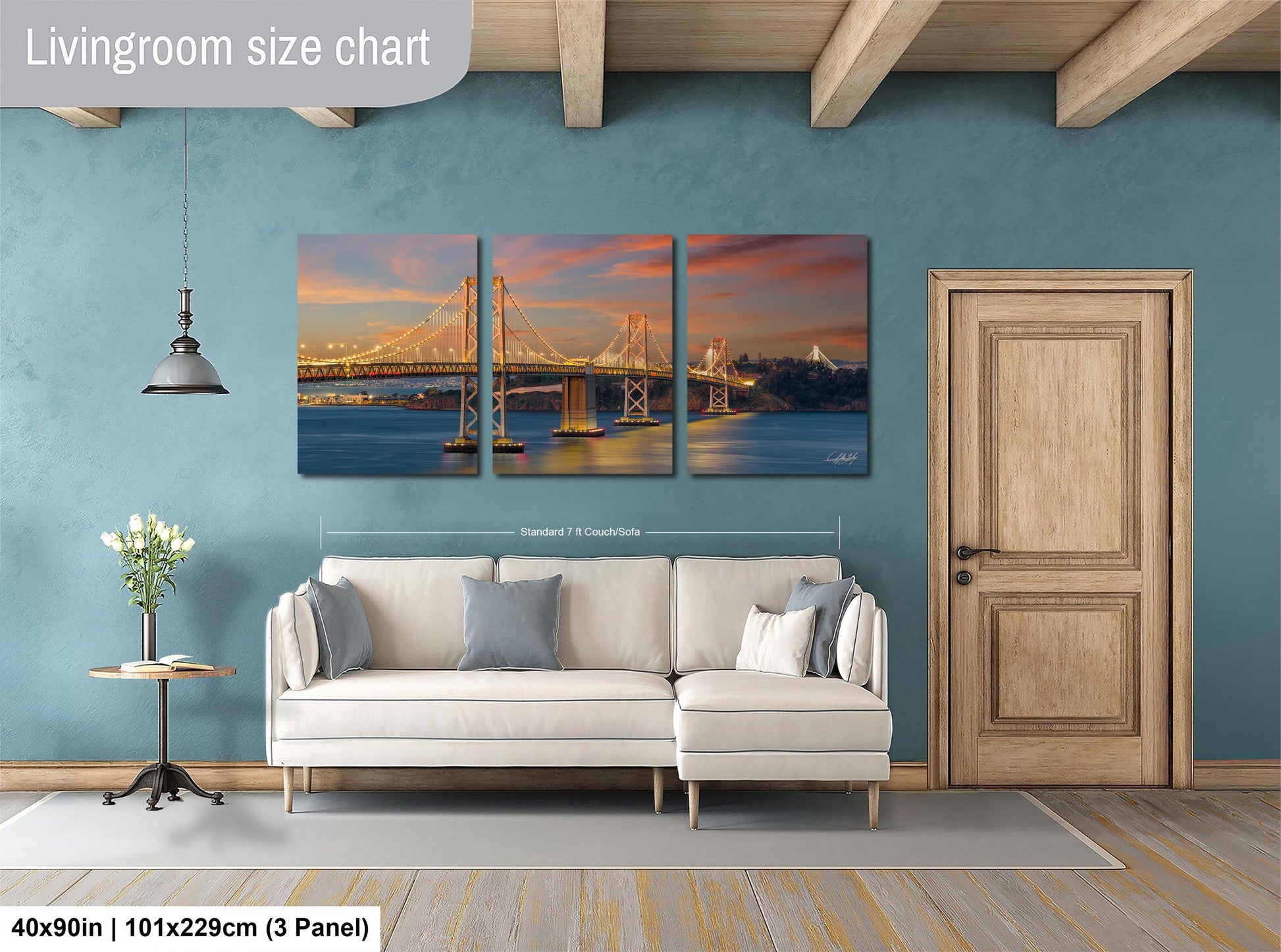 The image is a living room with a large, three-panel living room size chart on the wall. The chart displays the dimensions of the living room in feet and inches, with the largest panel being 40'x50'', followed by a smaller panel of 51'x29'', and the smallest panel of 3'x3''. The living room also includes a white sofa, a wooden door, and a vase of flowers on a table.